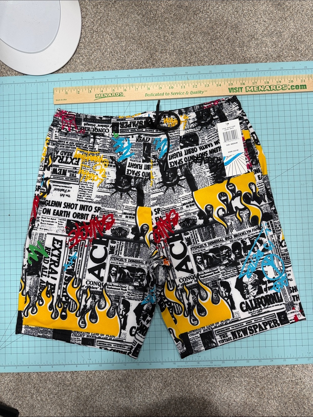 Men's Yellow & Black Graphic Athletic Swim Shorts with Newspaper Print